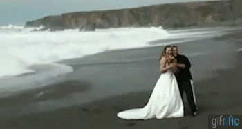 https://ruinmyweek.com/wp-content/uploads/2016/03/the-best-funny-pictures-wedding-fails-Wave-Knocks-Down-Bride-and-Groom.gif