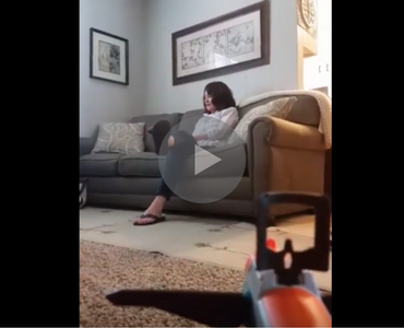 video of guy shooting nerf gun dart into mom's mouth