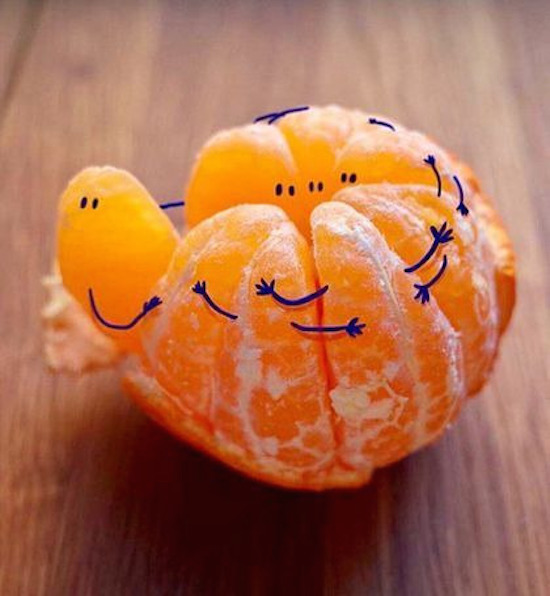 funny pictures of orange slices with hands and eyes drawn on them