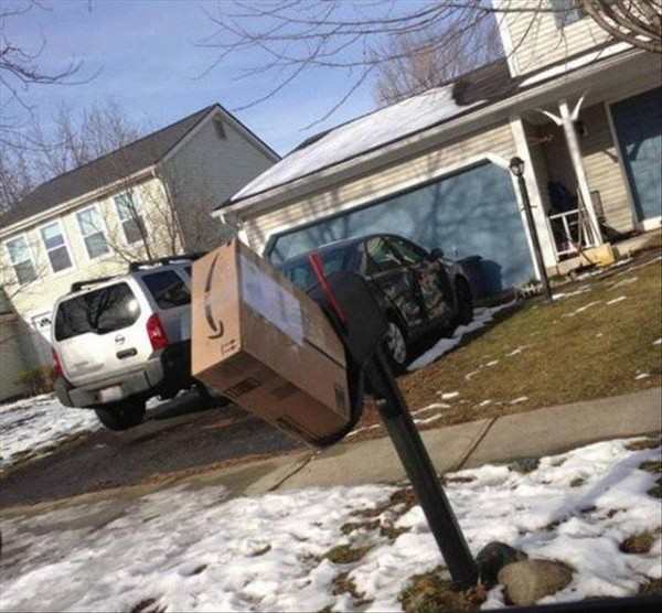 funny pic of large package shoved in small mailbox