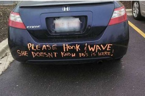 couple pranks ideas of please honk and wave written on back of car