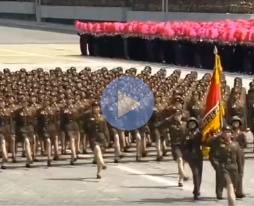 weird video of bee gees music over north koreans marching
