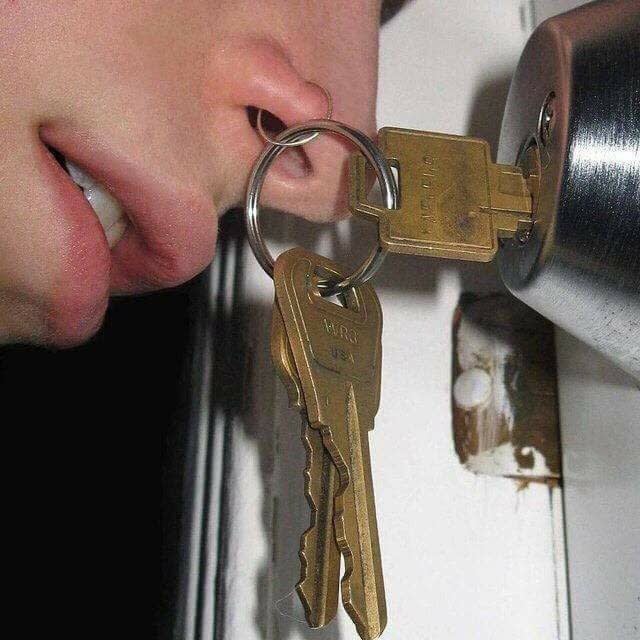 what appears to be a nose ring attached to key chain with keys in door cursed image, cursed images, cursed image meme, r/cursed images, rcursed images, r cursed images, weird images, random images, edgy cursed images