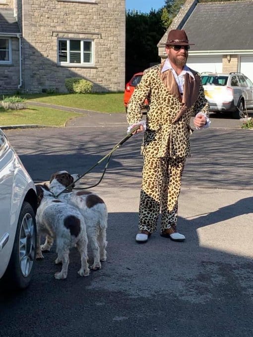 costumes quarantine, guy wears costumes to walk dog