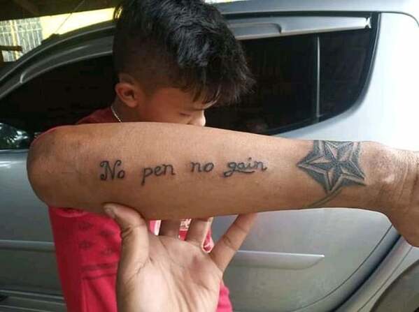 guy with tattoo that says no pen no gain, bone apple tea, funny grammar spelling fail