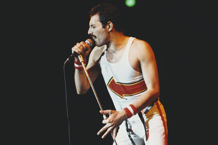 highest paid dead celebrities of 2020, Freddie Mercury singing into microphone