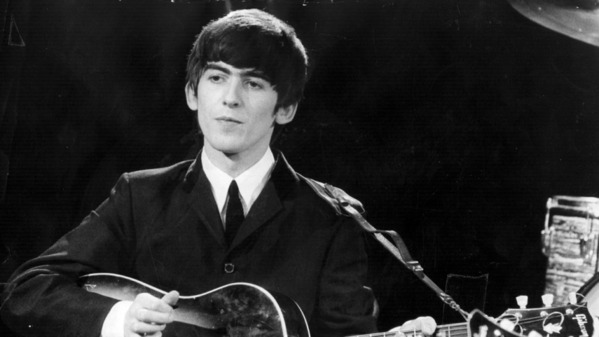 highest paid dead celebrities of 2020, George Harrison young playing guitar with the Beatles in black and white