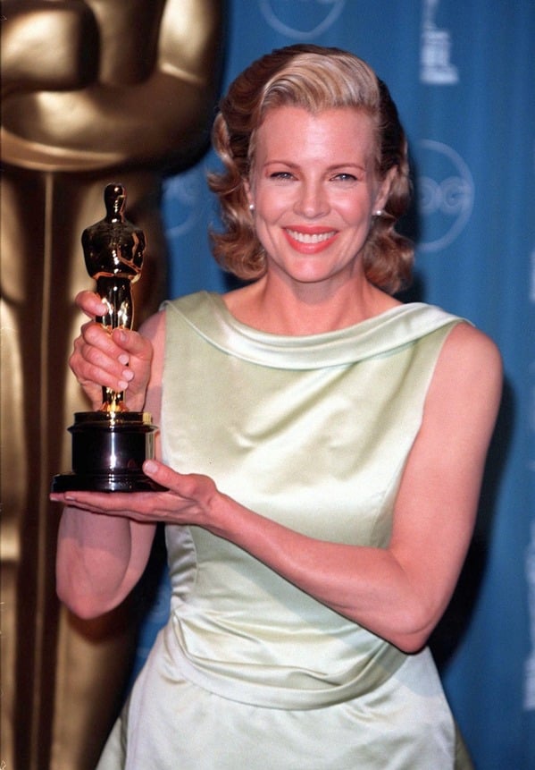 Celebrity weird facts, strange true stories about celebs, celeb facts that will make you rethink them forever, kim basinger holding oscar