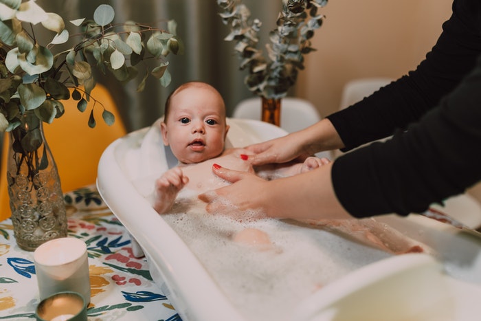 A Mother Bathing Her Baby