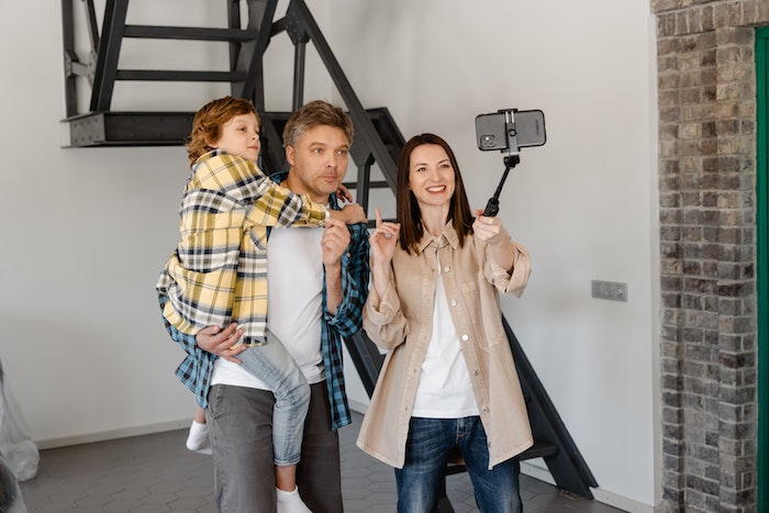 A Family Taking a Picture with a Smartphone