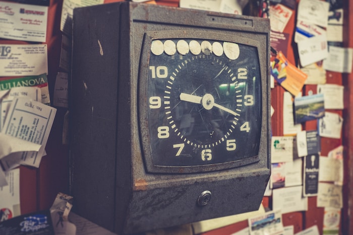 black and brown analog desk clock